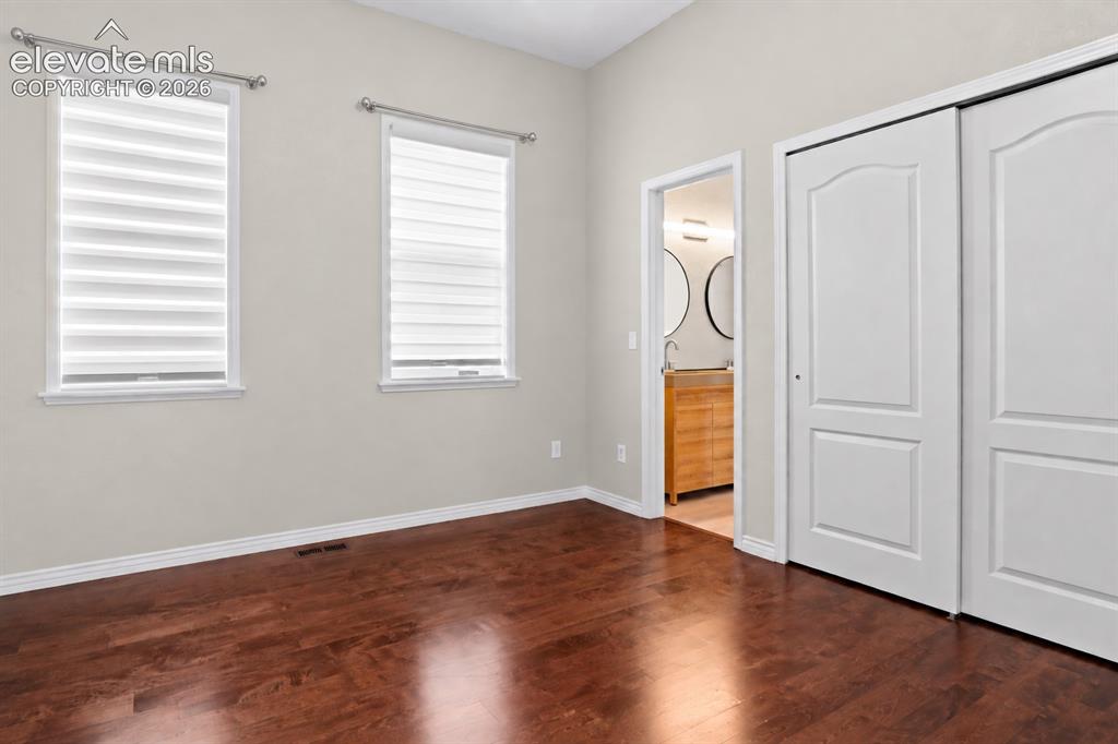 Image 24 of 44: Secondary bed #1 - Home Office or Guest Suite with access to Jack-n-Jill ba