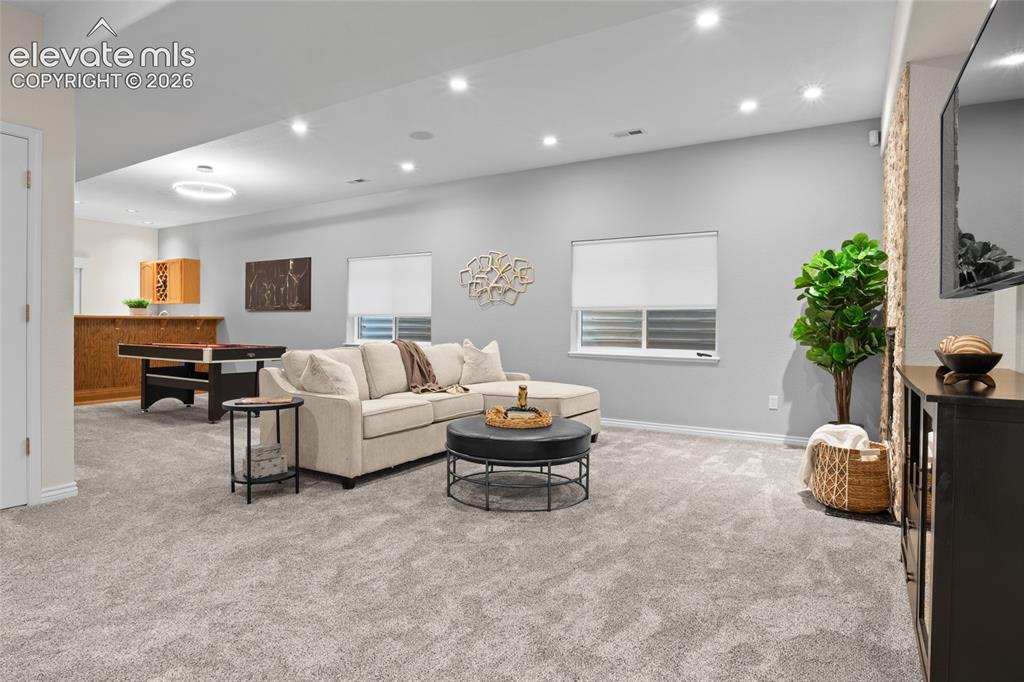 Image 28 of 44: Entertaining space continues in the lower level with new luxury carpet, Lut