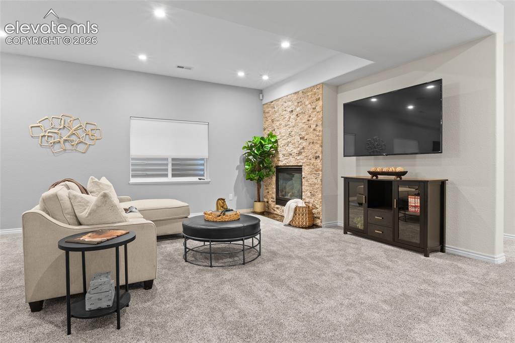 Image 29 of 44: Cozy up to the fire with your favorite friends & a movie.