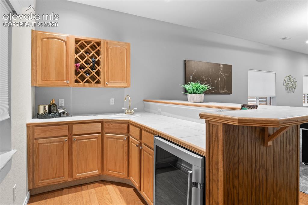 Image 32 of 44: Fully equipped wet bar is perfect for hosting Football Game gatherings or i