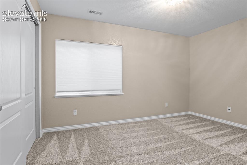Image 36 of 44: #5 Secondary bed in LL with neutral new paint and high end carpet