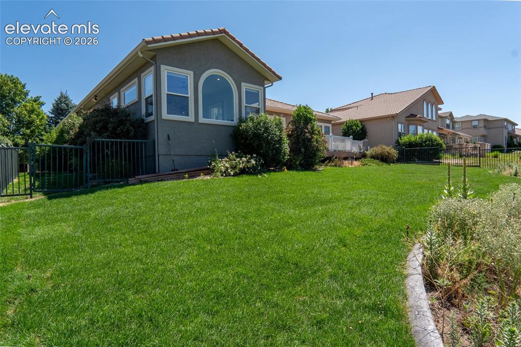 Image 37 of 44: Large level yard for hours of family fun