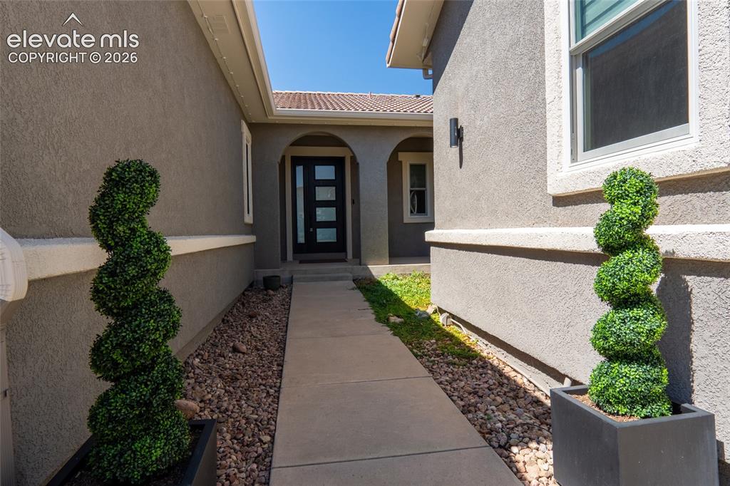 Image 43 of 44: Luxury private entrance through custom Therma-Tru door with sidelight