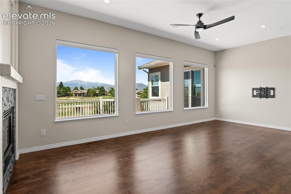 Image 6 of 50: Stunning Views, custom Lutron Serena smart shades and Maple Hardwood floors