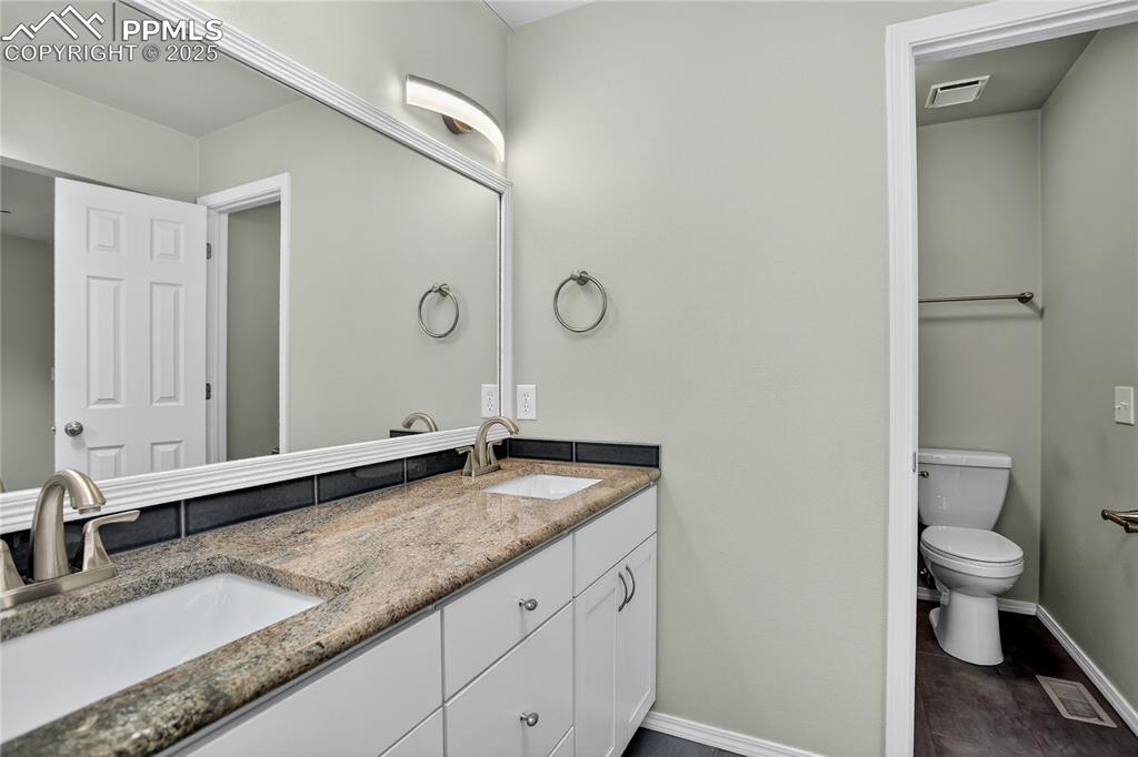 Image 13 of 28: Dual sink vanity