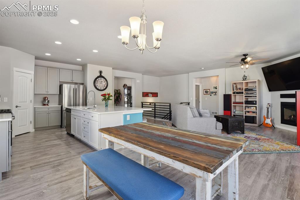 Image 18 of 47: Dining space with light wood-type flooring, a ceiling fan, recessed lightin