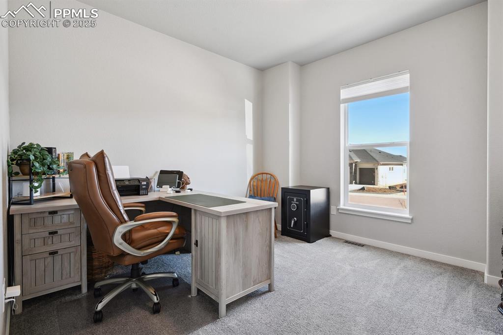 Image 6 of 47: Home office featuring light colored carpet and baseboards