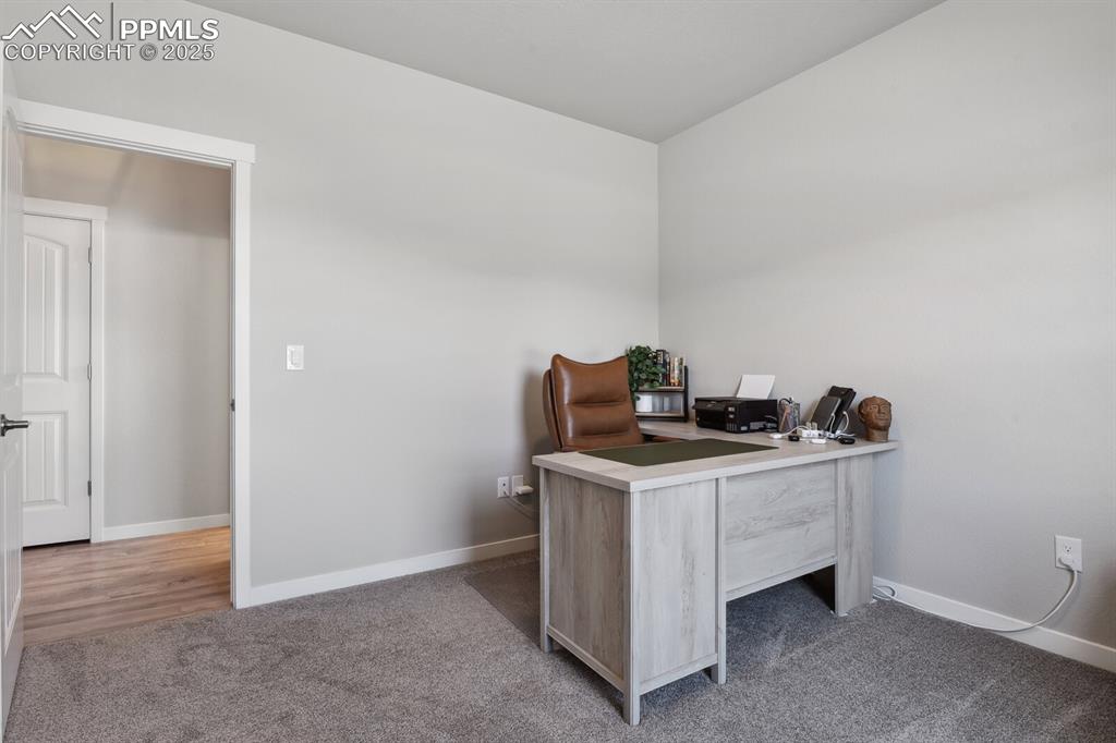 Image 7 of 47: Office space featuring carpet and baseboards