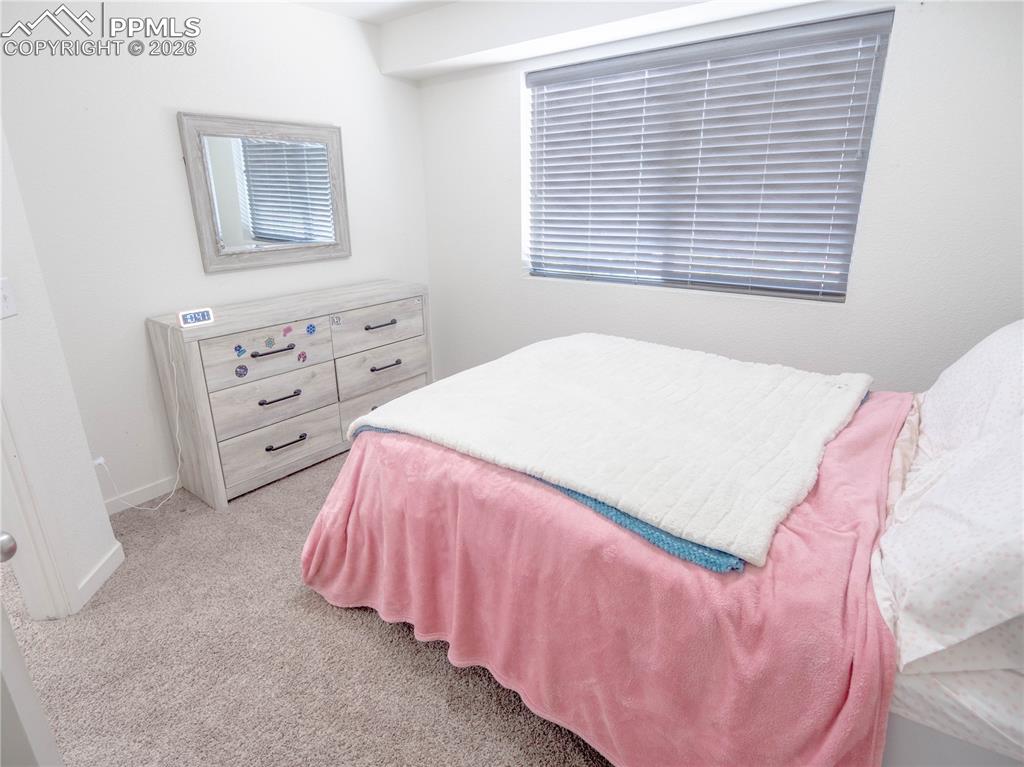 Image 13 of 30: Neutral wall color and plush carpeting create a versatile interior
