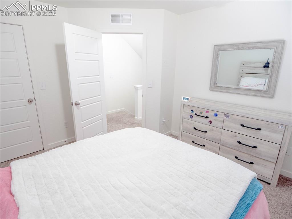 Image 14 of 30: Crisp white walls with contrasting five-panel interior doors
