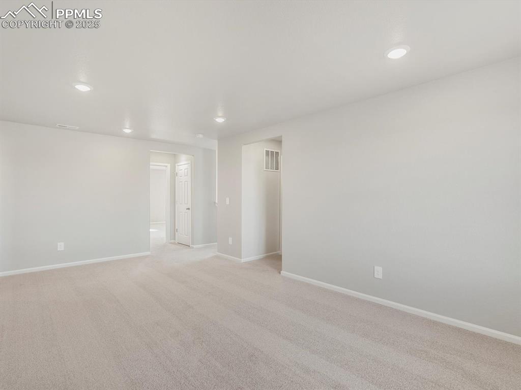 Image 15 of 27: Empty room featuring light carpet and recessed lighting
