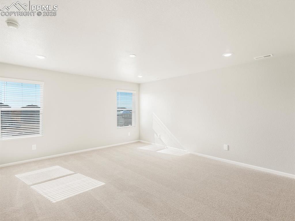 Image 18 of 27: Carpeted spare room featuring recessed lighting