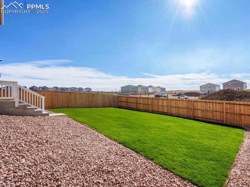 Image 27 of 27: View of fenced backyard