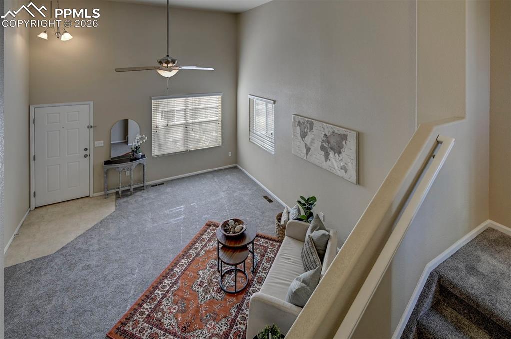 Image 10 of 44: Looking down from dinning area to living room.