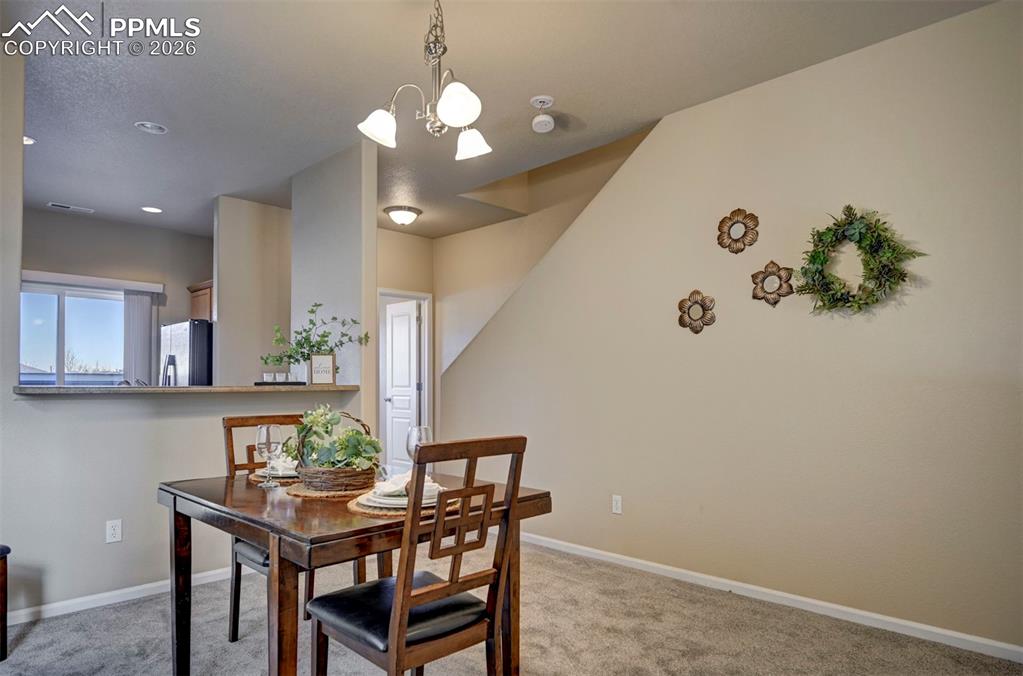 Image 11 of 44: Spacious dining room to eat and entertain in.