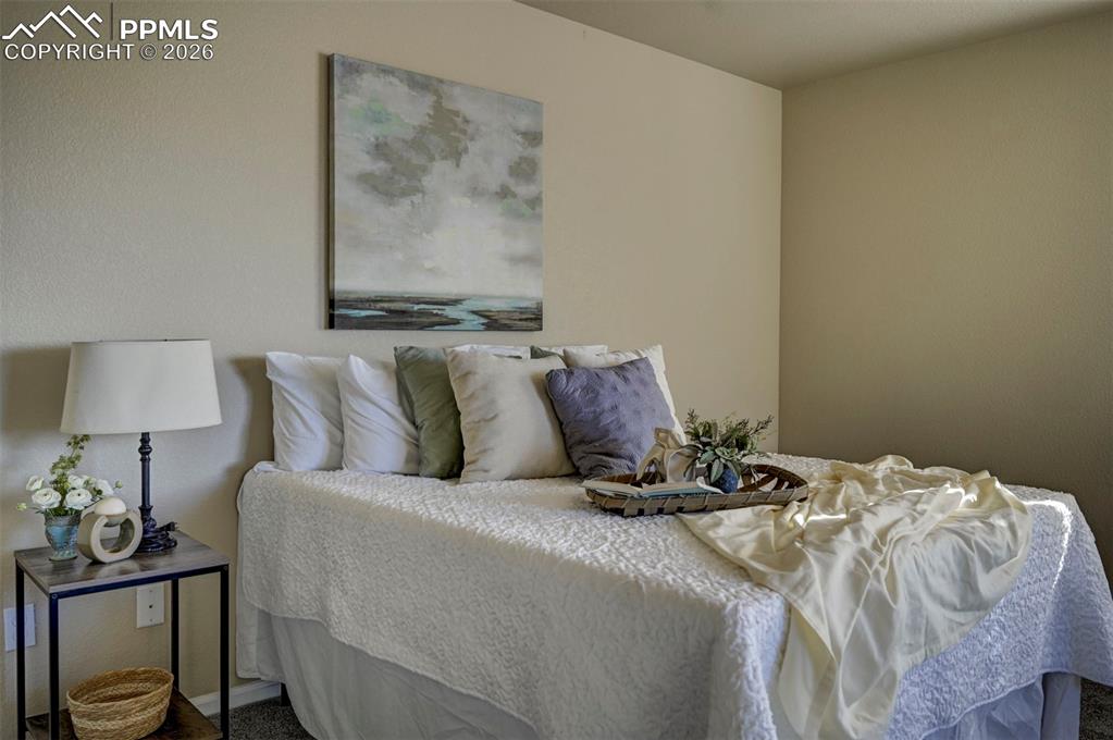 Image 31 of 44: Primary bedroom at top of stairs.