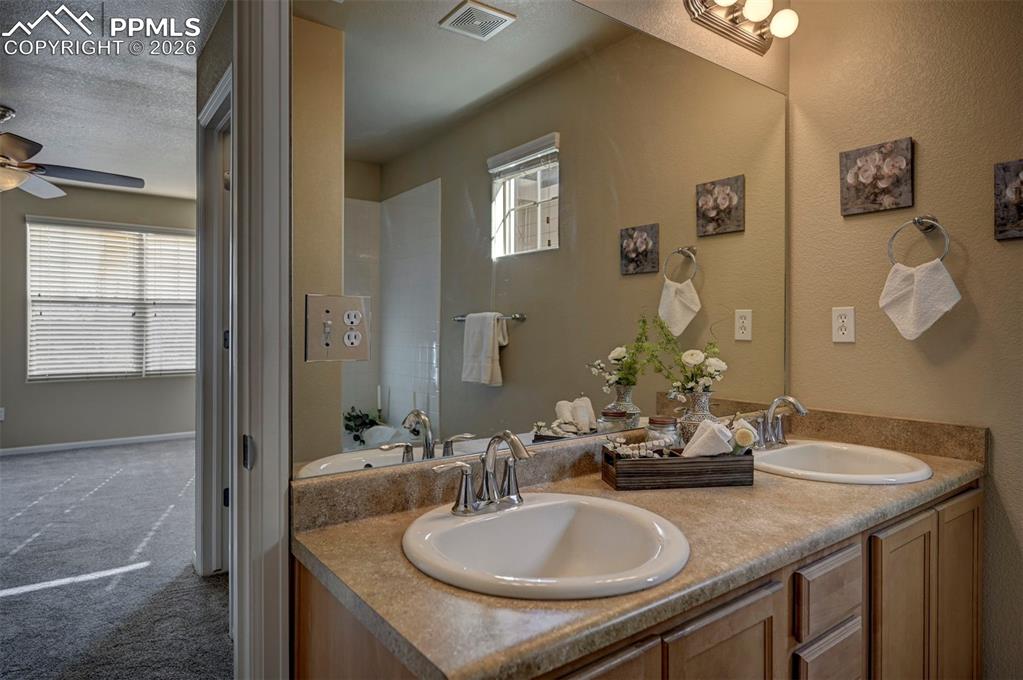 Image 35 of 44: Attached primary bedroom full bathroom.