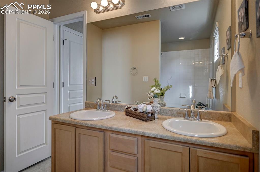 Image 36 of 44: Two sinks, lots of space in primary bathroom.