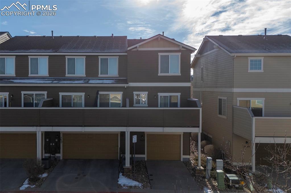 Image 40 of 44: Covered parking going into attached garage.