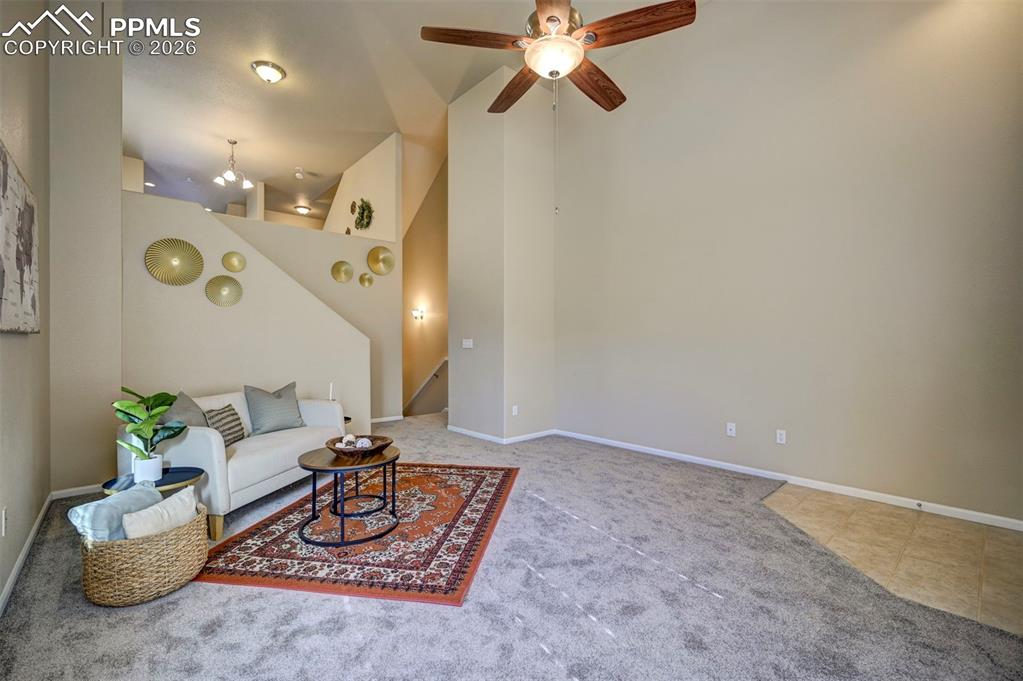 Image 8 of 44: From living room you can go up to the kitchen/dining area or down to the ga