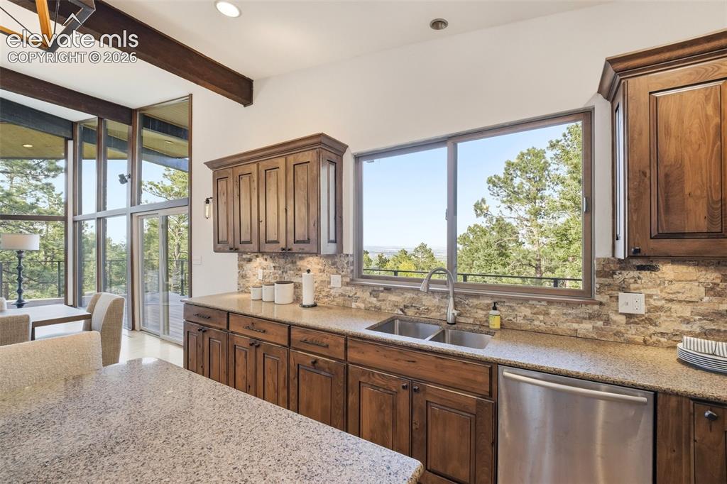 Image 19 of 48: Kitchen featuring wood cabinetry, granite countertops, stainless steel appl
