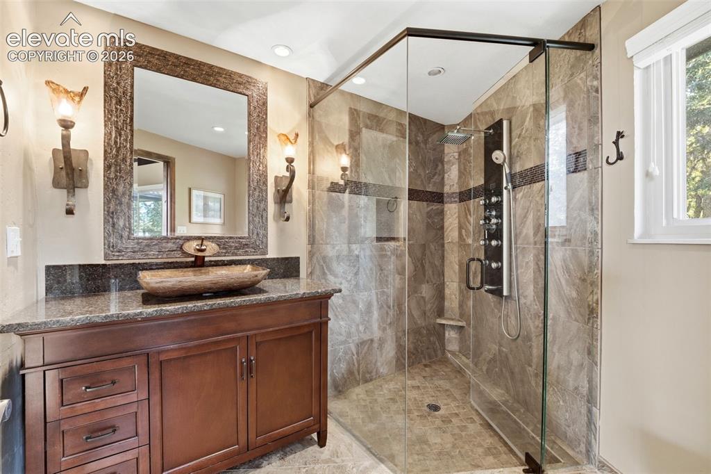 Image 29 of 48: Second master bathroom attached to second room on main