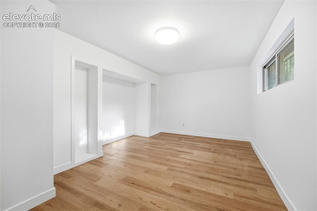 Image 35 of 48: Workout room or multipurpose room in basement