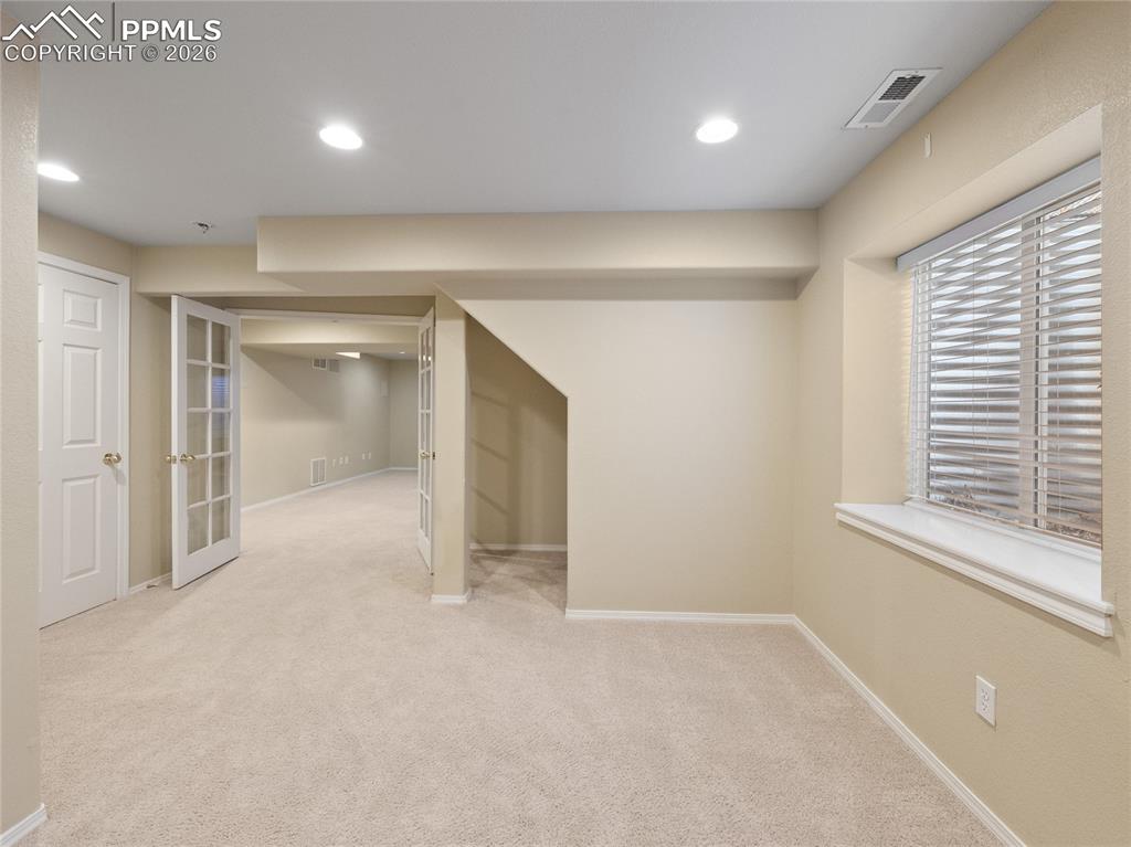 Image 40 of 46: Finished basement bedroom