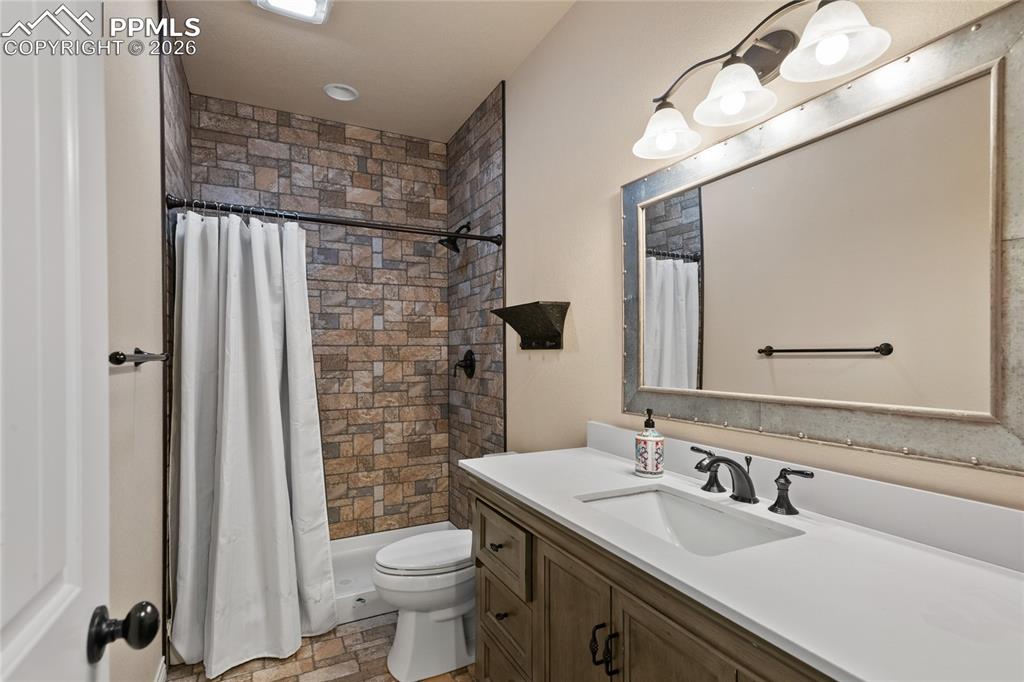 Image 40 of 49: Lower level 3/4 bath serves bedrooms 4 and 5.