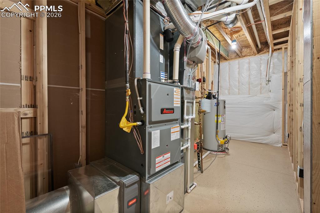 Image 43 of 49: Large mechanical room with 2 humidifiers and whole house water filter and e