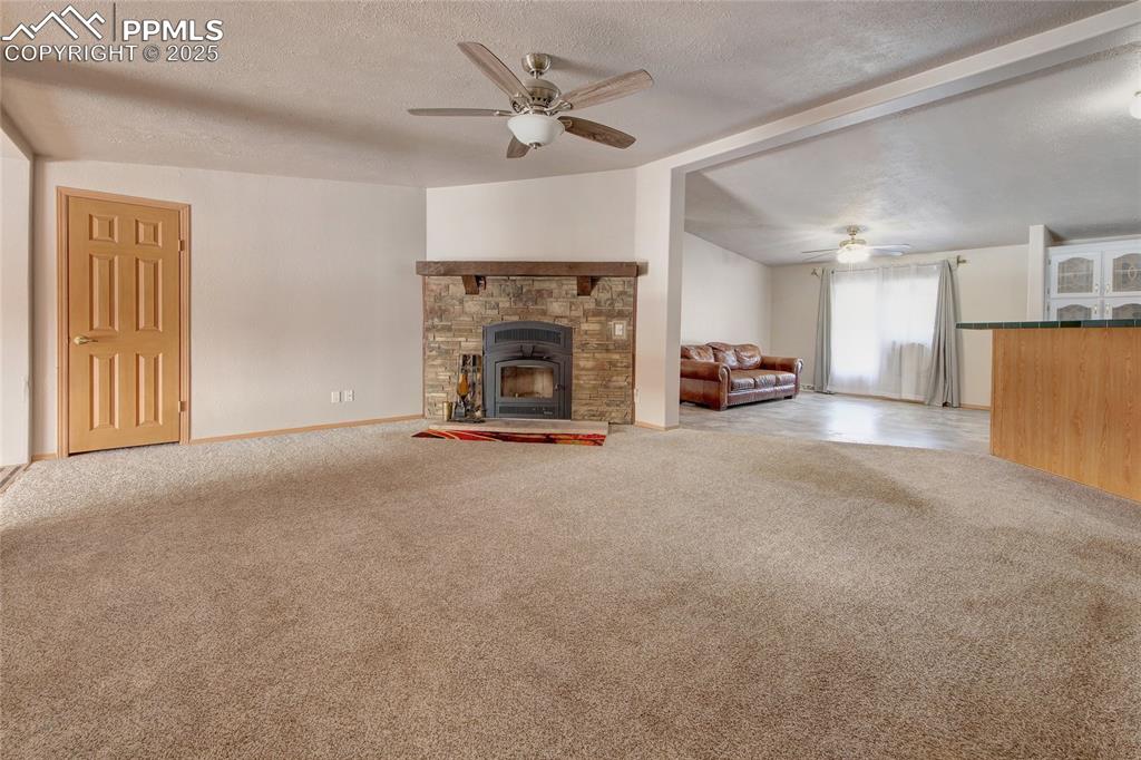 Image 13 of 50: Living room with dining room in the distance