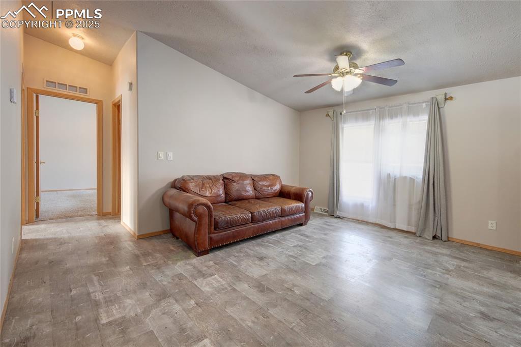 Image 15 of 50: Dining room is set up as a sitting area