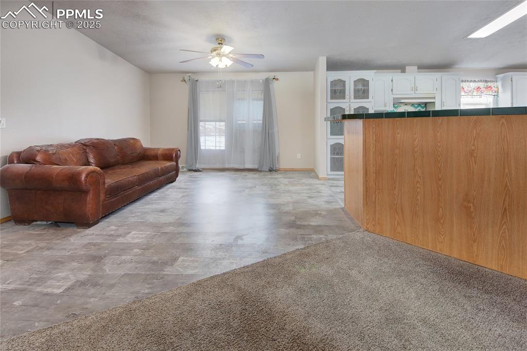 Image 18 of 50: Dining room ceiling fan and lvt floor