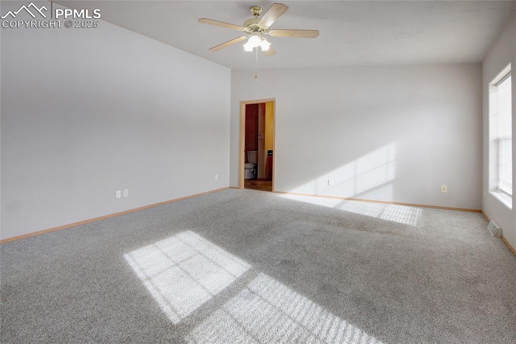 Image 19 of 50: Master bedroom adjoins to bath