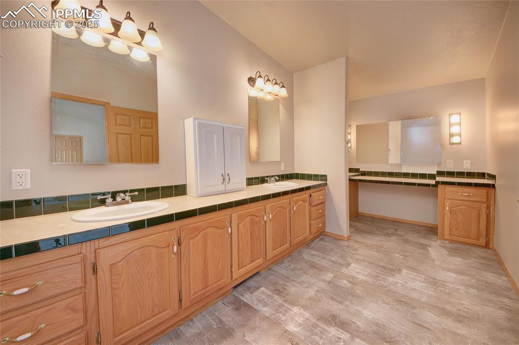 Image 21 of 50: Master bathroom is a 5 piece, with designated makeup area