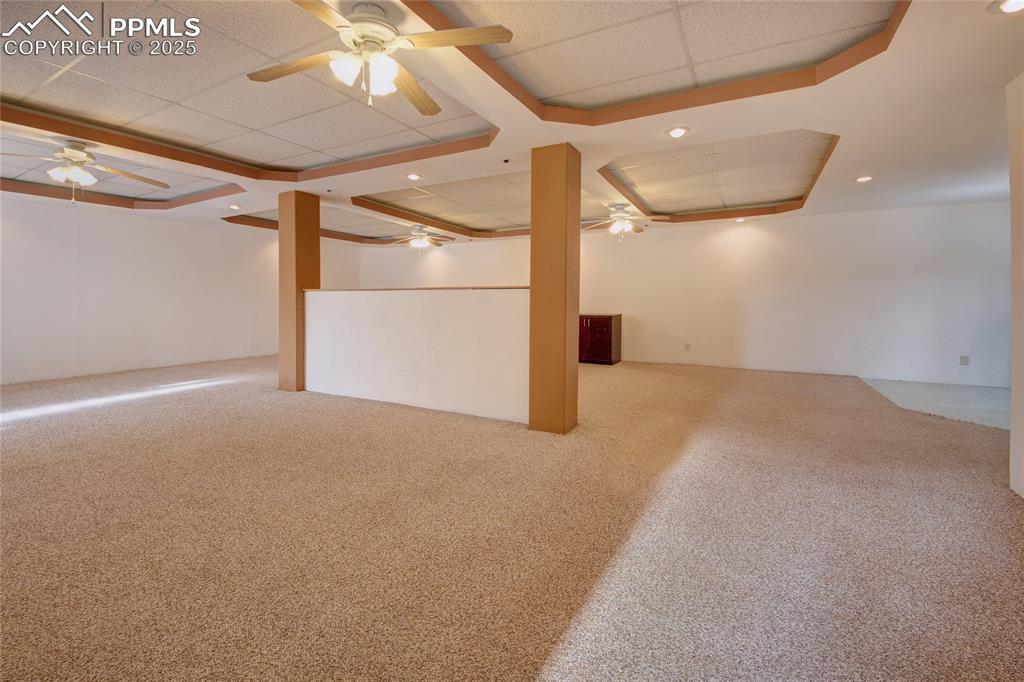 Image 33 of 50: Family room offers lots of ceiling fans and lights