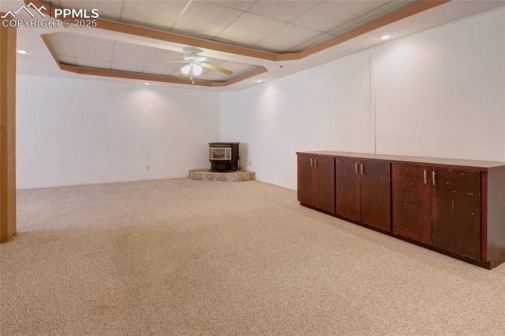 Image 35 of 50: Family room featuring a pellet stove