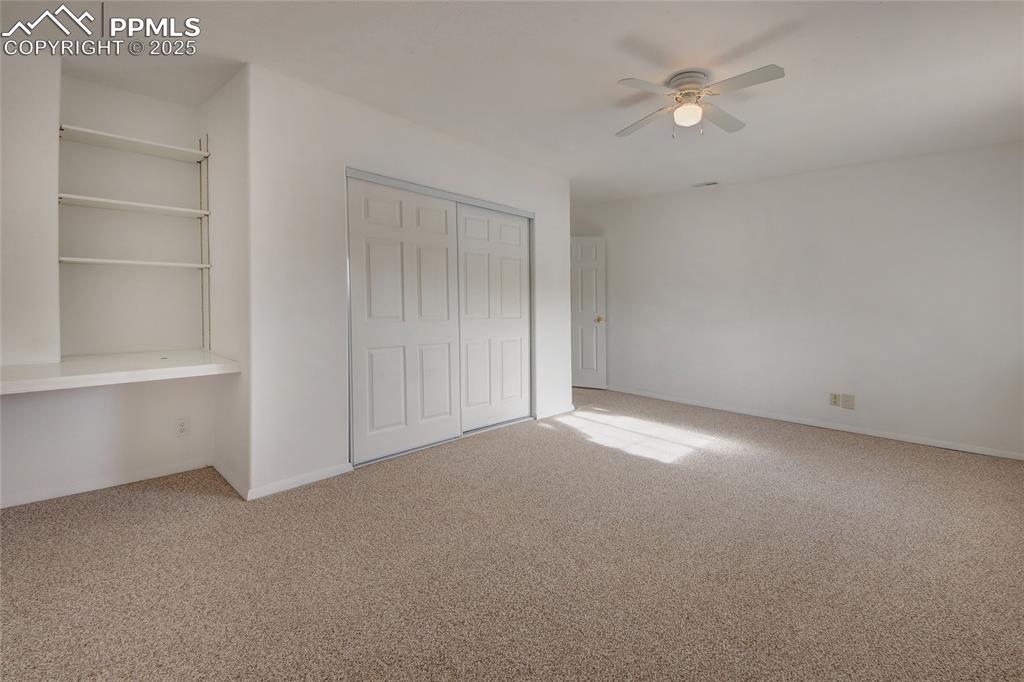 Image 37 of 50: Bedroom 4 with built ins and closet