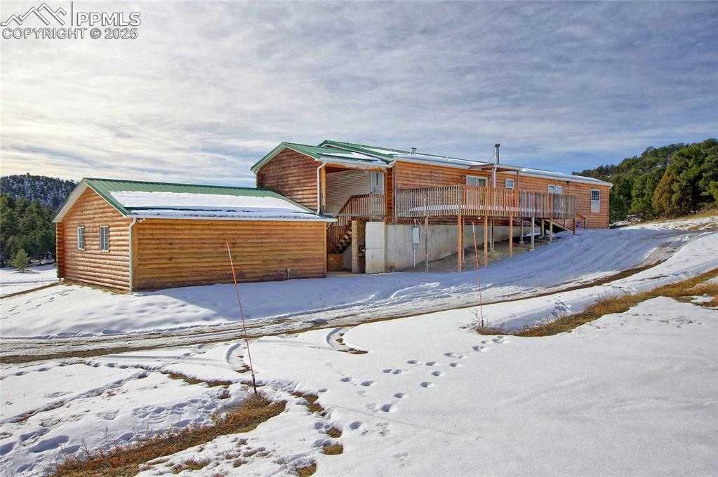 Image 41 of 50: Rear of property with a deck