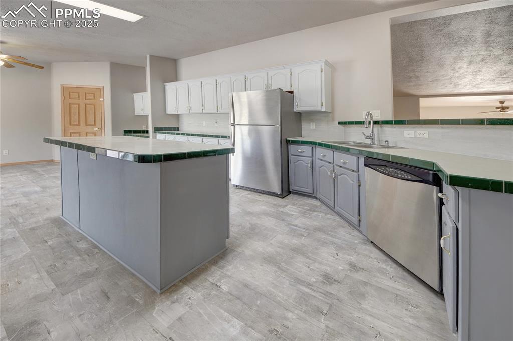 Image 5 of 50: Kitchen has stainless steel appliances and cabinets galore