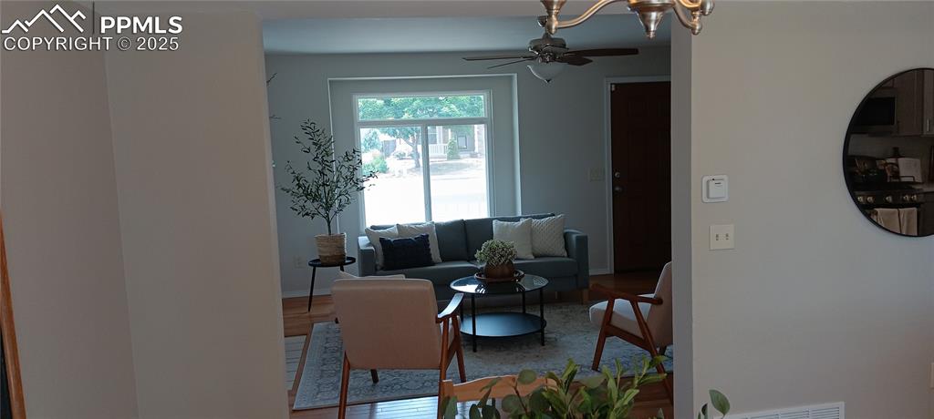 Image 13 of 45: View from Dining room through LR to front door