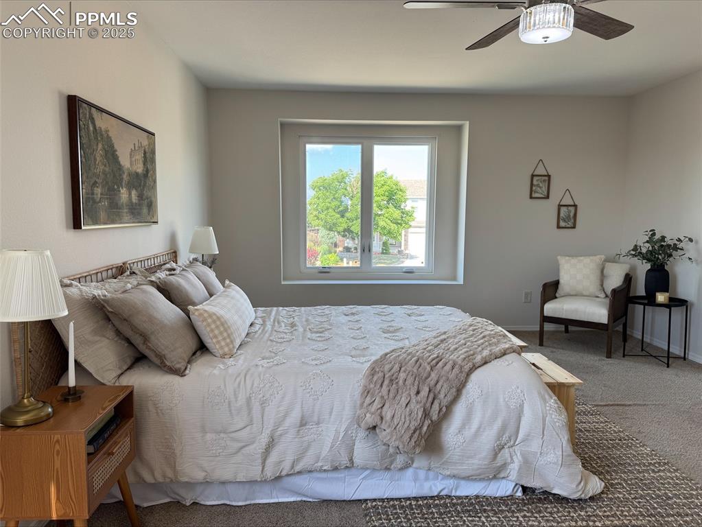 Image 17 of 45: Bedroom featuring carpet and a ceiling fan