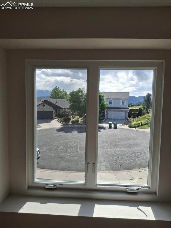 Image 21 of 45: Master Bedroom with a mountain view