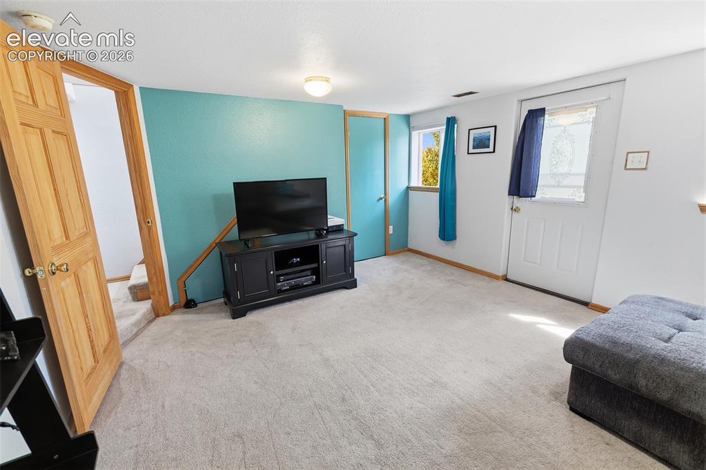 Image 19 of 27: Lower Level Bedroom 3 - Family Room