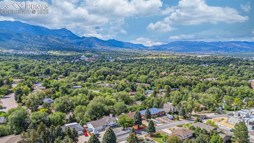 Image 44 of 44: Aerial perspective of suburban area with a mountainous background