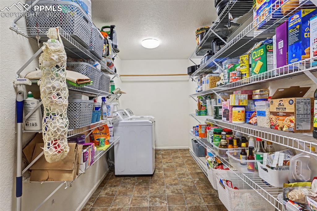 Image 13 of 47: Laundry and Kitchen Pantry Area just off Kitchen