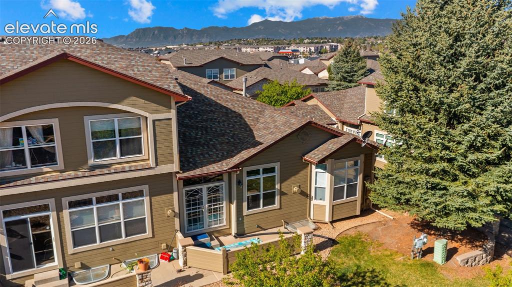 Image 25 of 31: Multi-story residential property featuring a neutral-toned exterior, multip