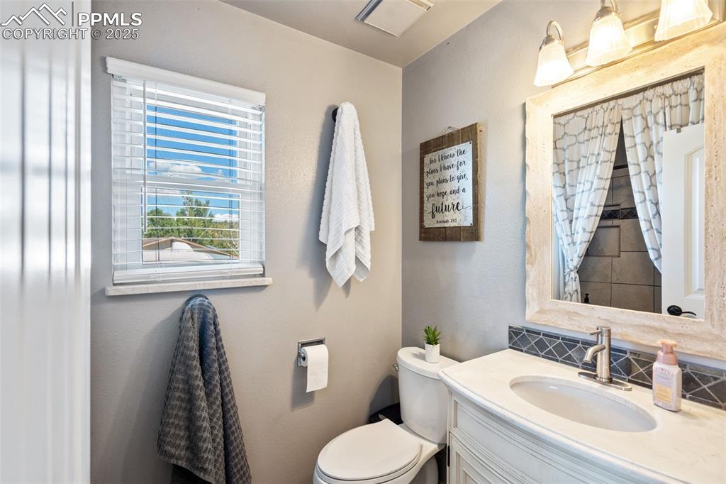 Image 24 of 49: Primary 3/4 bathroom with spa type shower.