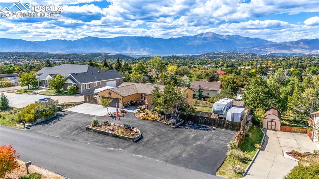 Image 4 of 49: Great curb appeal and low maintenance with a large paved driveway & parking