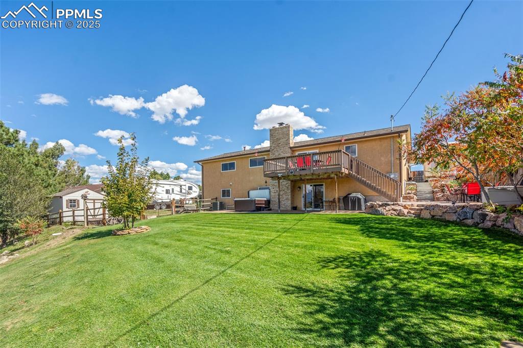 Image 40 of 49: Beautiful backyard space that is fully fenced and well cared for. 